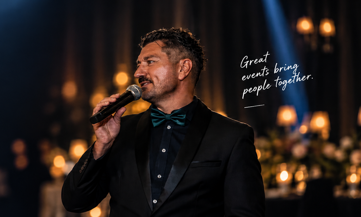 Bennum speaking on stage at an event